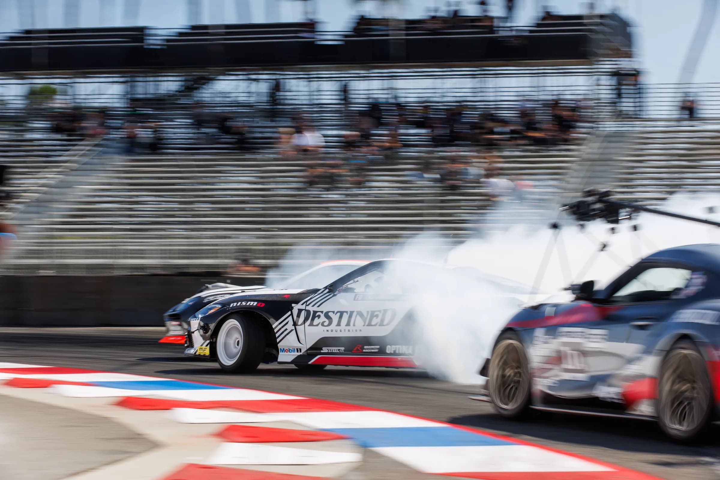 Tandem drift with crowd in stands